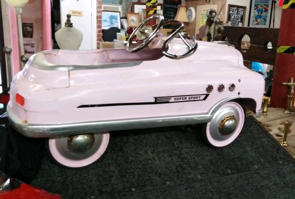 pink cadillac pedal car